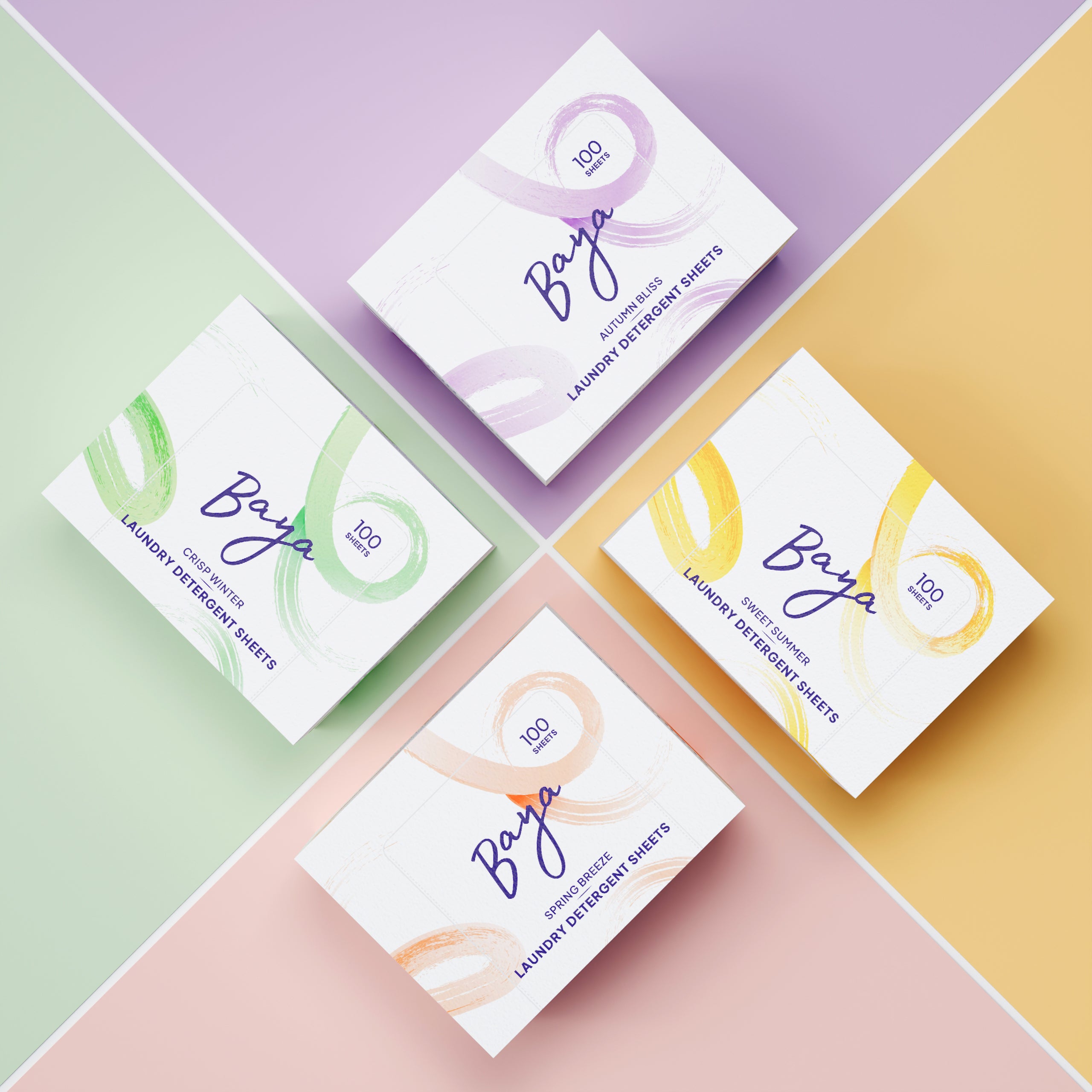 Four colorful boxes with abstract designs on a pastel background.